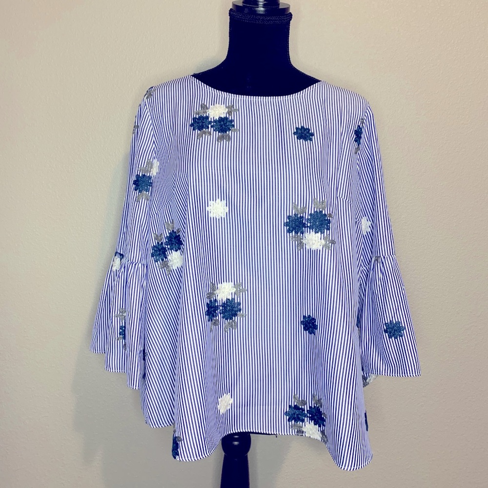 Embroidered blouse with flared sleeves
